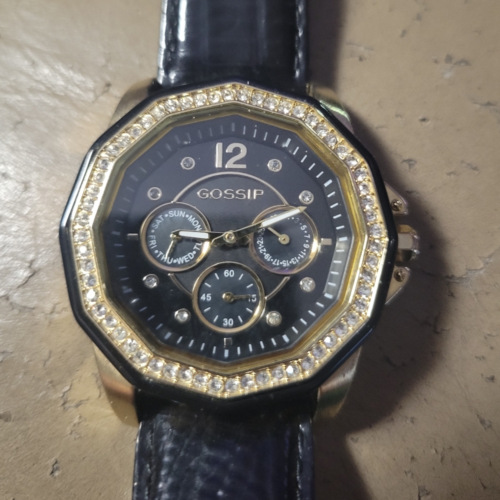 Ladies GOSSIP watch. Gold and black and Faux dia bezel. Nice shapec